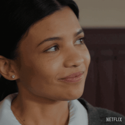 A Close Up Of A Woman 'S Face With A Netflix Logo On The Bottom GIF
