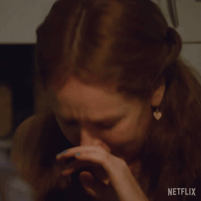 A Close Up Of A Woman 'S Face With A Netflix Logo Visible GIF