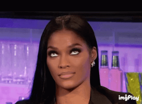 A Close Up Of A Woman 'S Face With A Purple Background And The Words Imgplay Below Her GIF