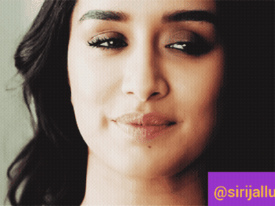 A Close Up Of A Woman 'S Face With A Purple Border That Says @Srijalu GIF