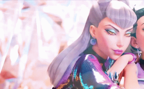 A Close Up Of A Woman 'S Face With A Purple Dress On GIF