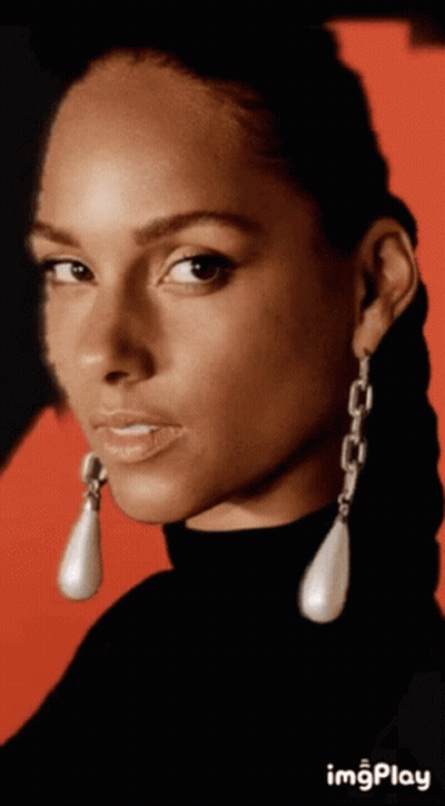 A Close Up Of A Woman 'S Face With A Red Background And The Word Imgplay Below It GIF