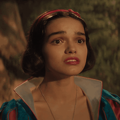 A Close Up Of A Woman 'S Face With A Red Headband On Her Head GIF