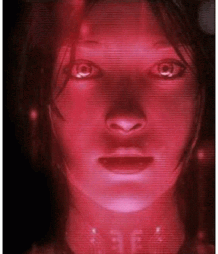 A Close Up Of A Woman 'S Face With A Red Light Coming Out Of Her Eyes GIF