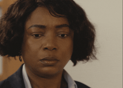 A Close Up Of A Woman 'S Face With A Sad Look On Her Face GIF