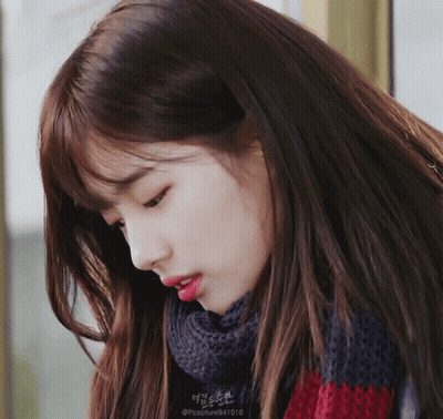 A Close Up Of A Woman 'S Face With A Scarf Around Her Neck That Says @Capture941010 GIF