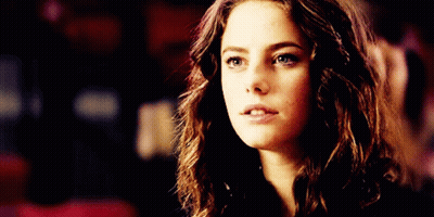 A Close Up Of A Woman 'S Face With A Serious Expression GIF