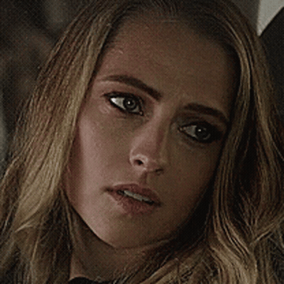 A Close Up Of A Woman 'S Face With A Serious Expression GIF