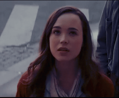 A Close Up Of A Woman 'S Face With A Serious Look On Her Face GIF