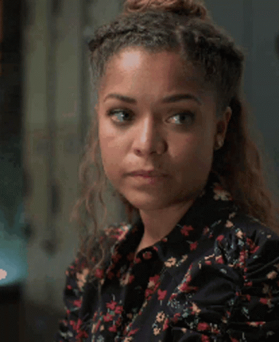 A Close Up Of A Woman 'S Face With A Serious Look On Her Face GIF