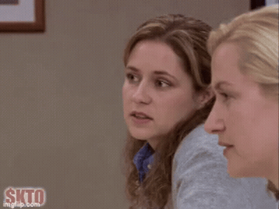 A Close Up Of A Woman 'S Face With A Slight Smile On Her Face . GIF