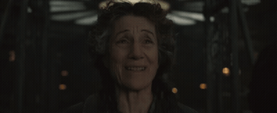 A Close Up Of A Woman 'S Face With A Smile On Her Face . GIF