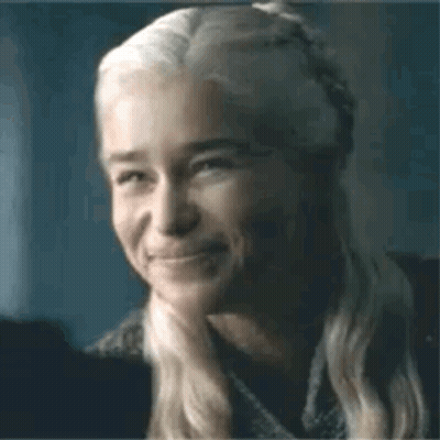 A Close Up Of A Woman 'S Face With A Smile On It . GIF