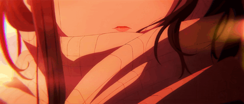 A Close Up Of A Woman 'S Face With A Spider Web Around Her Neck GIF