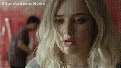 A Close Up Of A Woman 'S Face With A # Spontaneousmovie Written On The Bottom GIF