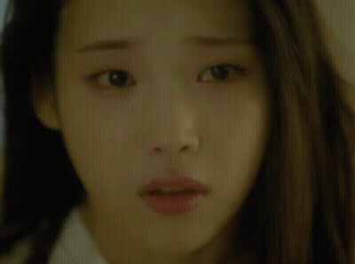 A Close Up Of A Woman 'S Face With A Surprised Expression GIF