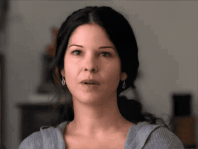 A Close Up Of A Woman 'S Face With A Surprised Expression GIF