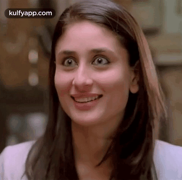 A Close Up Of A Woman 'S Face With A Surprised Expression On Her Face . GIF