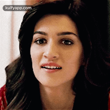 A Close Up Of A Woman 'S Face With A Surprised Expression On Her Face . GIF