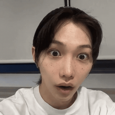 A Close Up Of A Woman 'S Face With A Surprised Look On Her Face GIF