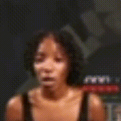 A Close Up Of A Woman 'S Face With A Surprised Look On Her Face GIF