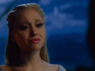 A Close Up Of A Woman 'S Face With A Tear Running Down Her Cheek . GIF