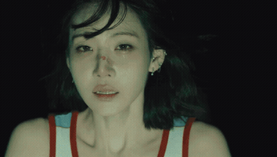 A Close Up Of A Woman 'S Face With A Tear Running Down Her Cheek GIF