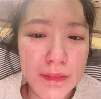 A Close Up Of A Woman 'S Face With A Tear Running Down Her Eye GIF