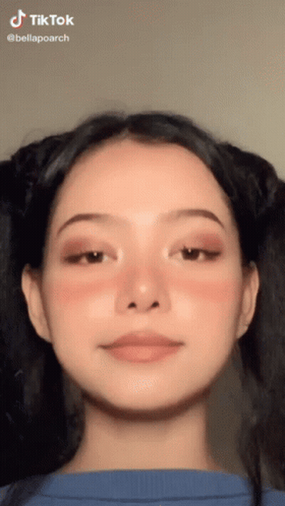 A Close Up Of A Woman 'S Face With A Tik Tok Watermark GIF
