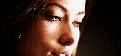 A Close Up Of A Woman 'S Face With A Tooth Missing GIF