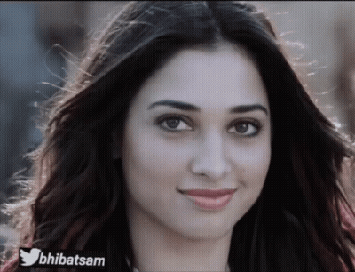 A Close Up Of A Woman 'S Face With A Twitter Logo On The Bottom Right GIF