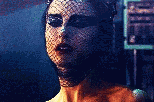 A Close Up Of A Woman 'S Face With A Veil On GIF