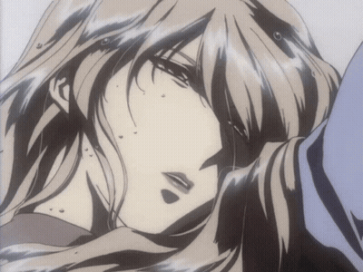 A Close Up Of A Woman 'S Face With A Very Long Hair GIF