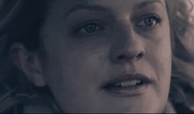 A Close Up Of A Woman 'S Face With A Very Serious Look On Her Face GIF