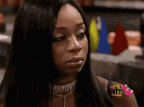 A Close Up Of A Woman 'S Face With A Vh1 Logo On Her Shoulder GIF