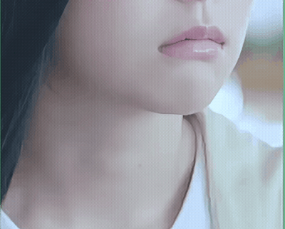 A Close Up Of A Woman 'S Face With A White Shirt On GIF