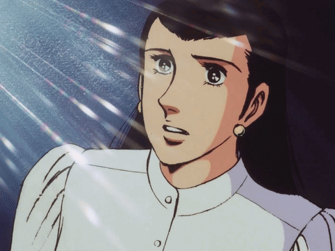 A Close Up Of A Woman 'S Face With A White Shirt GIF