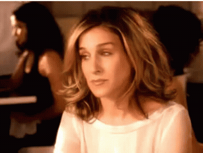 A Close Up Of A Woman 'S Face With A Woman In The Background GIF