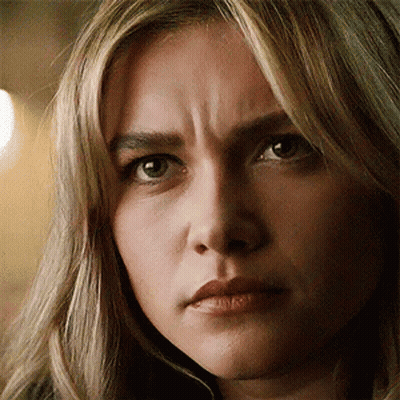 A Close Up Of A Woman 'S Face With A Wrinkle On Her Forehead . GIF
