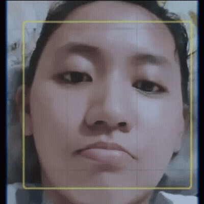 A Close Up Of A Woman 'S Face With A Yellow Border Around Her Face . GIF