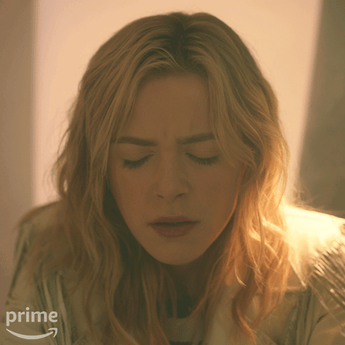 A Close Up Of A Woman 'S Face With An Amazon Prime Arrow In The Corner GIF