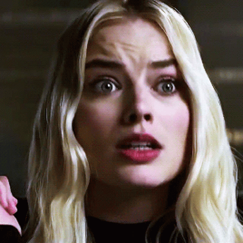A Close Up Of A Woman 'S Face With Blonde Hair GIF