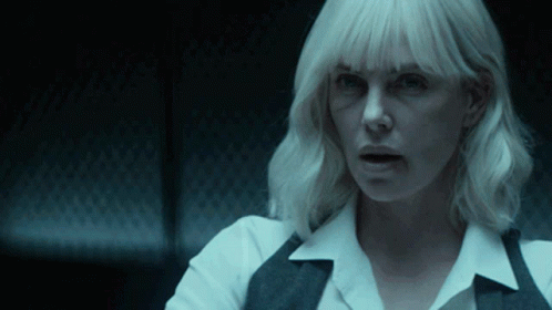 A Close Up Of A Woman 'S Face With Blonde Hair GIF