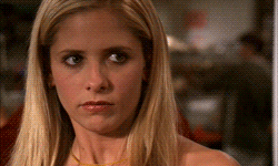 Blonde Woman Face Close Up With Yellow Necklace GIF