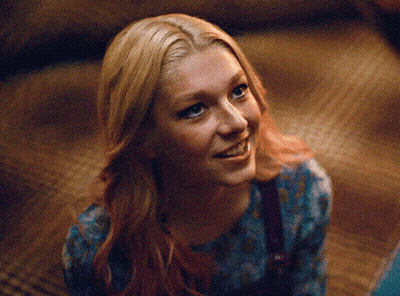 A Close Up Of A Woman 'S Face With Blonde Hair GIF