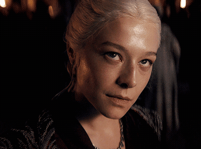 A Close Up Of A Woman 'S Face With Blonde Hair GIF
