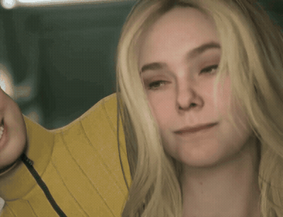 A Close Up Of A Woman 'S Face With Blonde Hair GIF