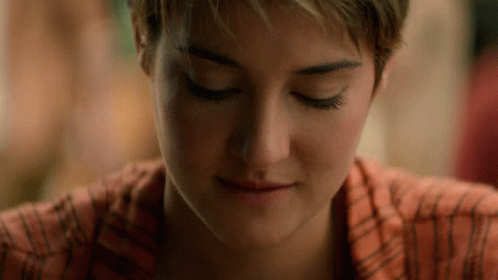 A Close Up Of A Woman 'S Face With Closed Eyes GIF