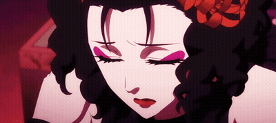 A Close Up Of A Woman 'S Face With Closed Eyes And A Flower In Her Hair GIF