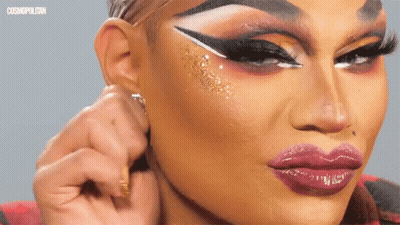 A Close Up Of A Woman 'S Face With Cosmopolitan Written On The Bottom Right GIF